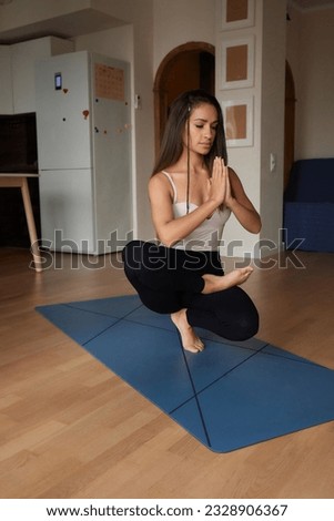 Mind Harmony. Closeup Shot Of Young Beautiful Woman Meditating With Closed Eyes, Calm Brunette Female Practicing Meditation Or Praying, Keeping Hands In Namaste Gesture Near Face