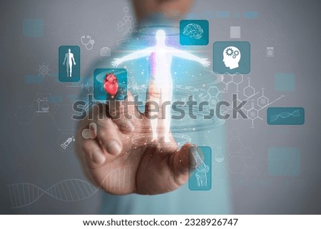 Man on blurred background using digital x-ray human body holographic scan projection 3D rendering. Doctor hand show a hologram of the patient on a blurred background. Royalty-Free Stock Photo #2328926747