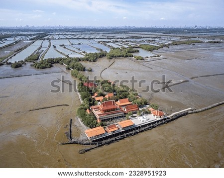 Wat Khun Samut Chin in Samut Prakan, Thailand. There was a village around the temple, but when mangrove forests where cleared for shrimp farms, erosion removed the village by 3-5 metres per year.