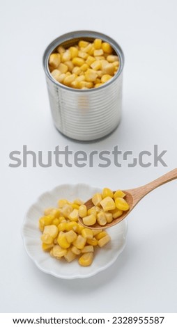 Canned corn on white background.
