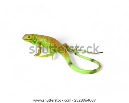 Toy miniature iguana isolated on white