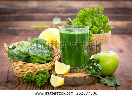 Fresh green smoothie in the glass Royalty-Free Stock Photo #232897306