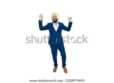 Cheerful indian sikh businessman wearing suit dancing bhangra with joy isolated over white background. Corporate Concept.