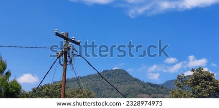 electric poles in mountainous areas with very sunny weather, jakarta indonesia, july 9 2023