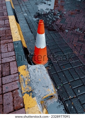 Wet Traffic Cone After Rain
