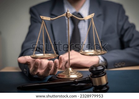 Lawyer's hand concept Justice with Judge gavel, Businessman in suit or Hiring lawyers in the digital system. Legal law, prosecution, legal adviser, lawsuit, detective, investigation,legal consultant. 
