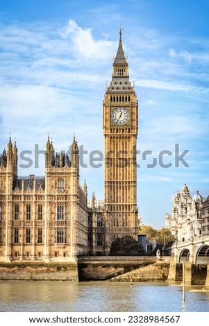 View across Thames river to Elizabeth tower, also known as Big Ben, at Westminster palace in London. Royalty-Free Stock Photo #2328984567