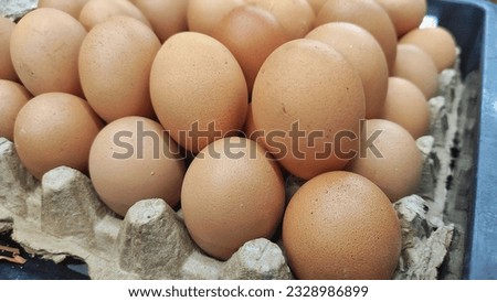 Pile of egg on the eggs cartoon in displayed in supermarket to attract the buyer