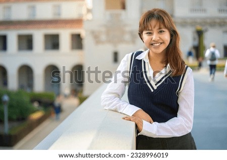 Clean commercial portrait of a friendly female multiethnic student, in college or high school, diversity and equity