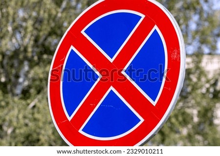 Colored automobile road sign, a red and blue road sign prohibiting the stopping and parking of vehicles