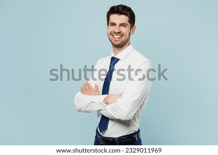 Young smiling happy cheerful successful employee business man corporate lawyer wear classic formal shirt tie work in office look camera isolated on plain pastel light blue background studio portrait
