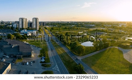 Riga, Latvia - June 15 2023 : Aerial view of growing Skanste district in city Riga during sunset
