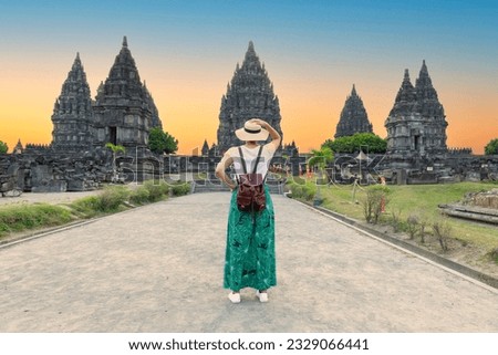 Woman traveler at Prambanan temple near Yogyakarta city, Central Java, Indonesia Royalty-Free Stock Photo #2329066441