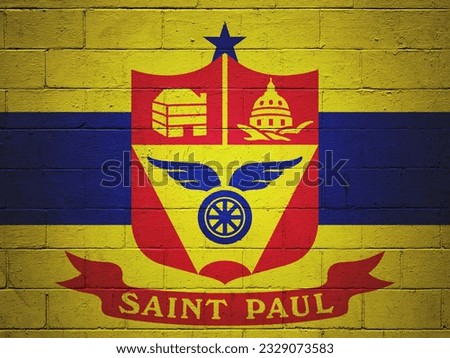 Flag of Saint Paul painted on a cinder block wall.