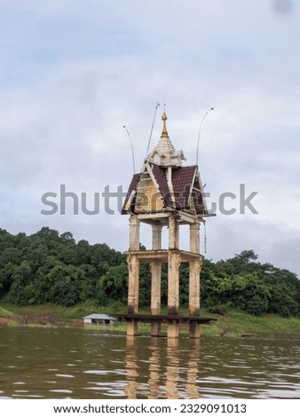 Boat ride to see the flood temple in Kanchanaburi, Thailand