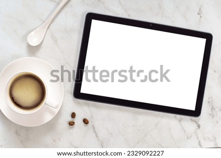 Mockup with tablet and coffee cup. Coffee break during work concept