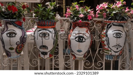 Typical balcony flower pots painted with human heads in Sicilia, Italy
 Royalty-Free Stock Photo #2329101389