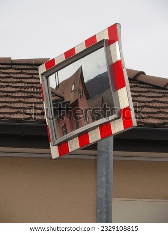 Red and white reflective mirror sign 
