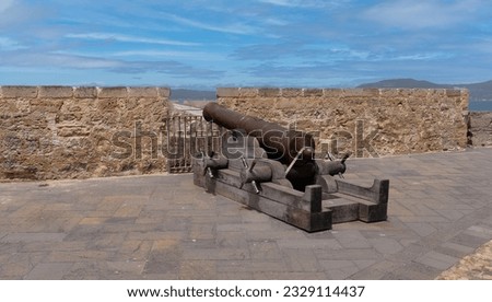 close-up of the catapults and cannons of the promenade of the ramparts of alghero
