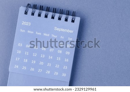 September 2023 Monthly desk calendar for 2023 year on blue background. Royalty-Free Stock Photo #2329129961