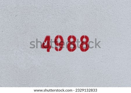 Red Number 4988 on the white wall. Spray paint.
