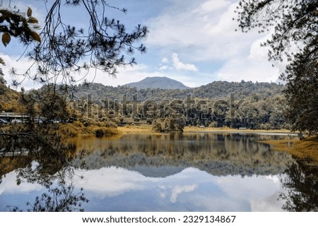 A view of Situ Patenggang or Patenggang Lake in Ciwidey, Bandung, Indonesia. The air so fresh, water so clearthat it can reflect a trees