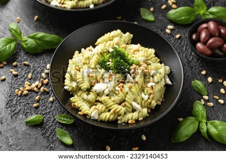 Creamy broccoli feta cheese pasta with pine nuts. Healthy food Royalty-Free Stock Photo #2329140453