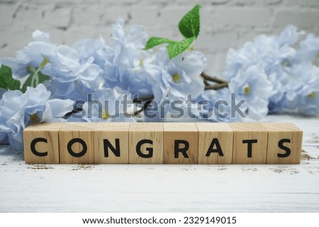Congrats alphabet letter with space copy on wooden background