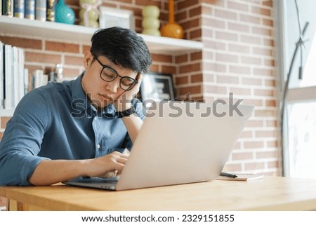 close up young employee man take a nap in the day feeling lazy and sleepy after break time at office , lifestyle people concept Royalty-Free Stock Photo #2329151855