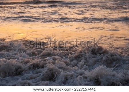 Ocean waves at dawn. Ocean waves at sunrise. Ocean waves at sunset