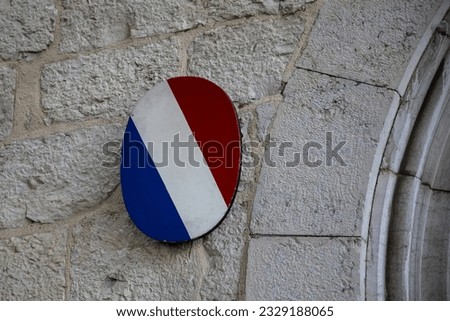 france flag french blue white red round panel on entrance wall official building