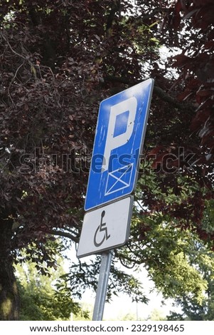 Inclined road sign, a sign for the start of parking and places for people with disabilities, disabled parking for people, mobility issues, accessibility parking with spaces sign, wheelchair sign