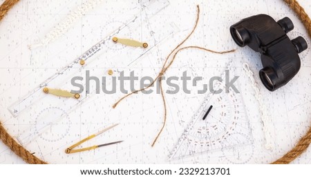Navigation tools are on the navigation map. Plotter, divider, ruler, pencil and binocular as well as the Manila rope.