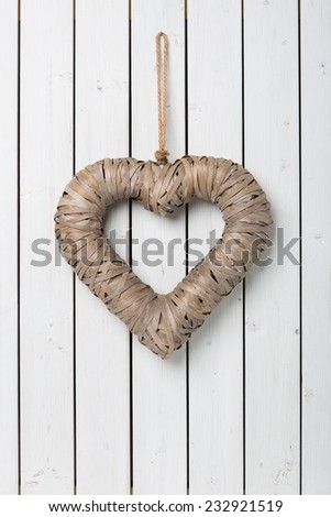 Big heart on white wooden background