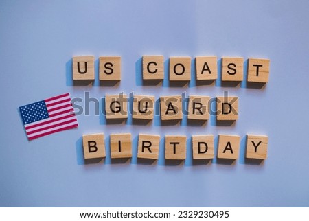 August 4, US Coast Guard Day, the flag of the United States, a minimalistic banner with the inscription in wooden letters