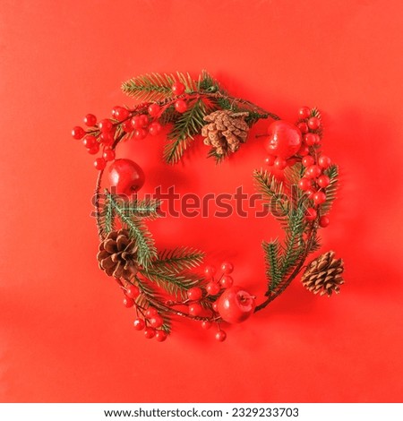 Festive Christmas and new year decorations on red background,flat lay.