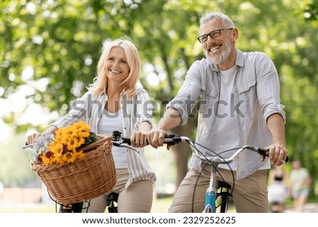 Portrait Of Happy Mature Couple Riding Retro Bicycles In Summer Park, Cheerful Senior Spouses Having Fun Together Outdoors, Smiling Elderly Man And Woman Enjoying Free Time On Retirement, Closeup