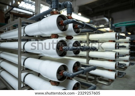 A large industrial set installation of reverse osmosis system and nanofiltration membranes for water treatment. Royalty-Free Stock Photo #2329257605