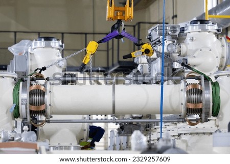 Installation work at a gas insulated switchgear(GIS) for extra high voltage electrical power substation. Sulfur hexafluoride used in the electrical industry as a gaseous dielectric. Royalty-Free Stock Photo #2329257609