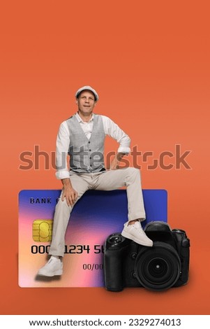 Young businessman with digital camera using credit card for paying, Delighted individual harmonizing commerce and creativity atop modern camera.