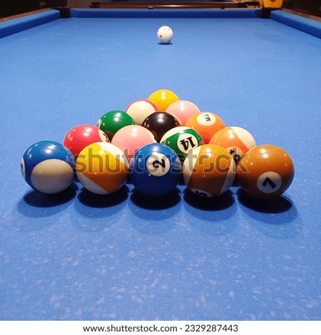 Close up of billiard balls in triangle shape. This is 8 Ball Pool sport, before kickoff