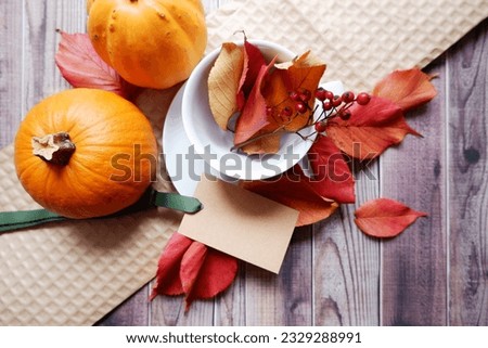 Thanks giving and Autumn concept colorful leaves and pumpkins decoration background. Harvest and Thanks giving day greeting composition.