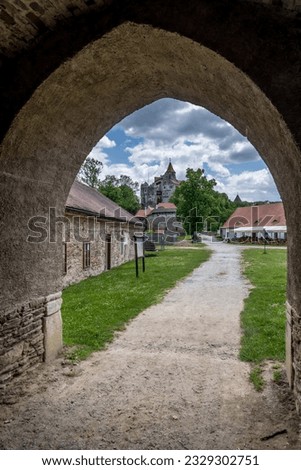 Pernstejn castle framed by the fortified gate arch