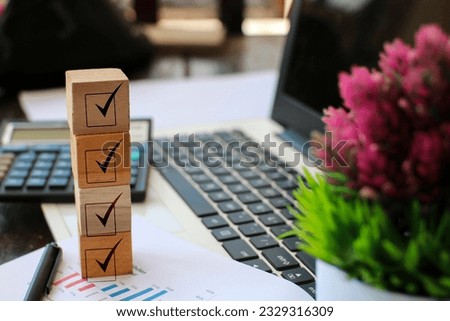 wooden block with checklist icon there is free space for text on office desk background