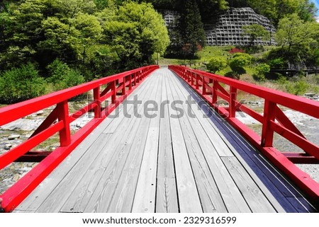 Japan, wooden bridge crossing on a sunny day