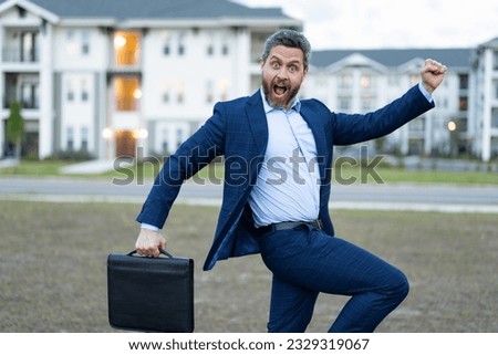 amazed real estate business man outdoor. photo of real estate business man. real estate business man