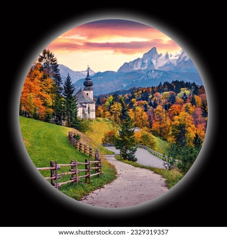 Picture in a circle on black background. Spherical image of Bavaria with Maria Gern church with Hochkalter peak on background. Fantastic autumn sunrise in Alps. View through the spyglass.
