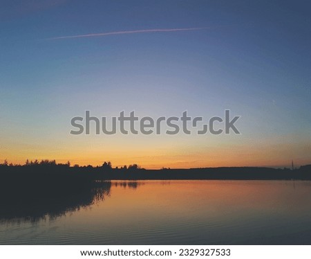 photo during sunset. wild lake in the evening. landscape in summer.