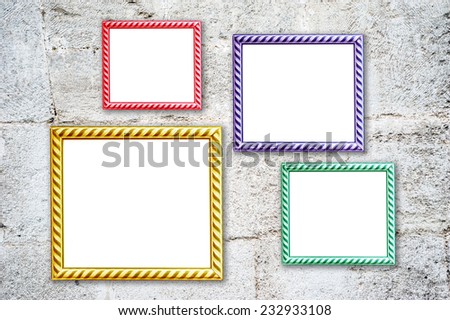 Four multicolored photo frames on the retro wall