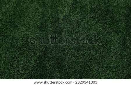 Synthetic grass field with deep green color makes this photo can be made for your wallpaper design